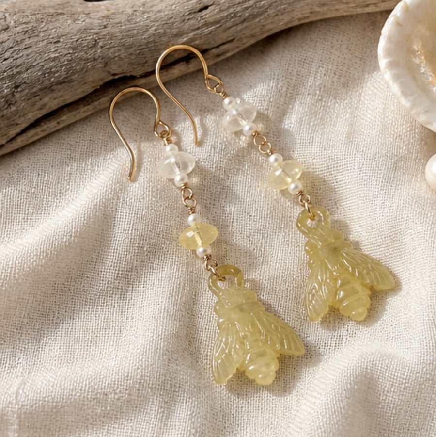 carved mother of pearl bee earrings with faceted opals