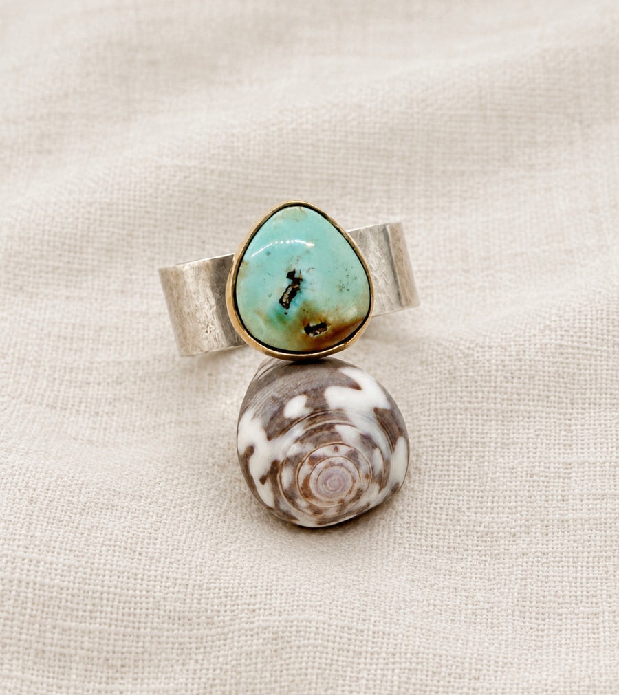Irregular shaped turquoise ring in sterling silver with a gold fill bezel, size 8.5